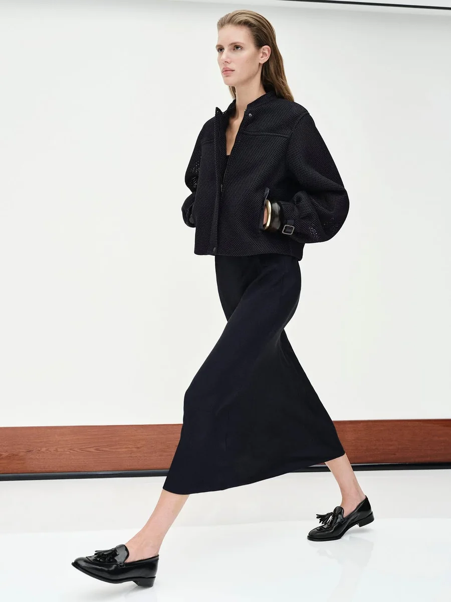 Max Mara's All-Black Column on a petite woman