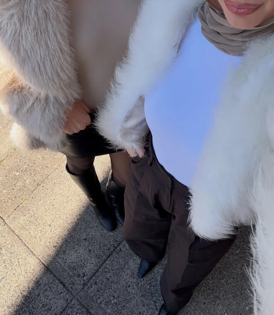 White Fur, Dark Trousers on a petite woman