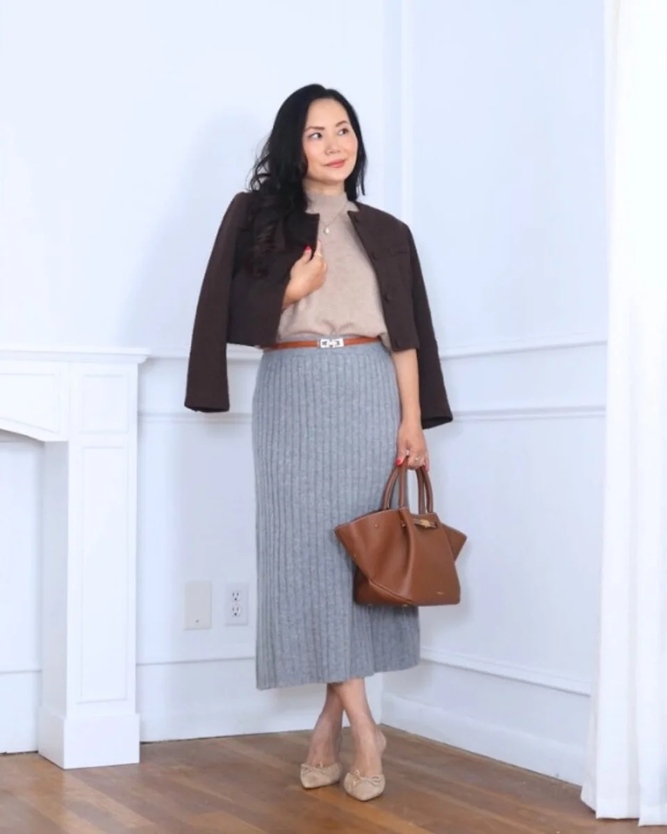 The Cropped Jacket Over a Knit Midi on a petite woman