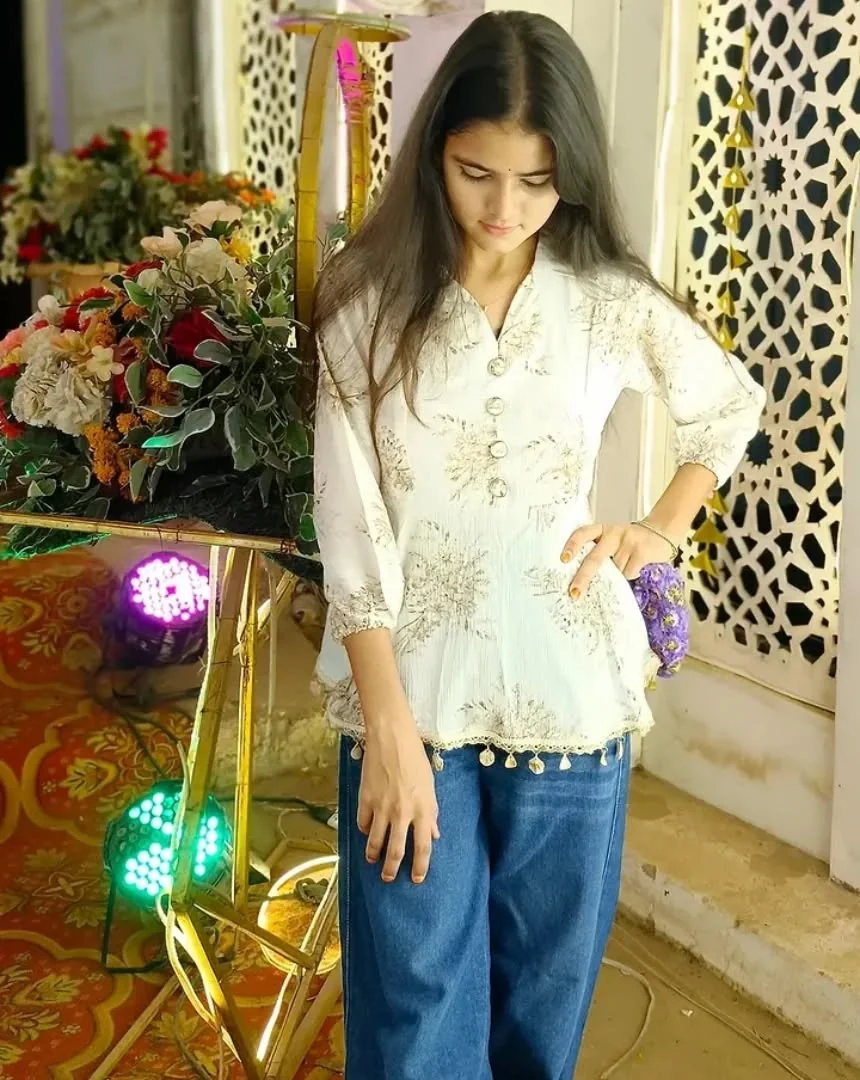 The Peplum Top Defines the Waist on a petite woman