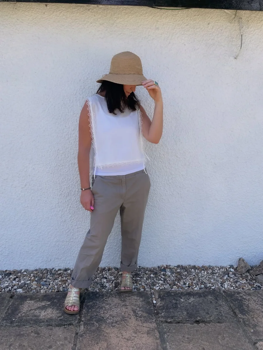 Cropped Trousers With Rolled Cuffs on a petite woman