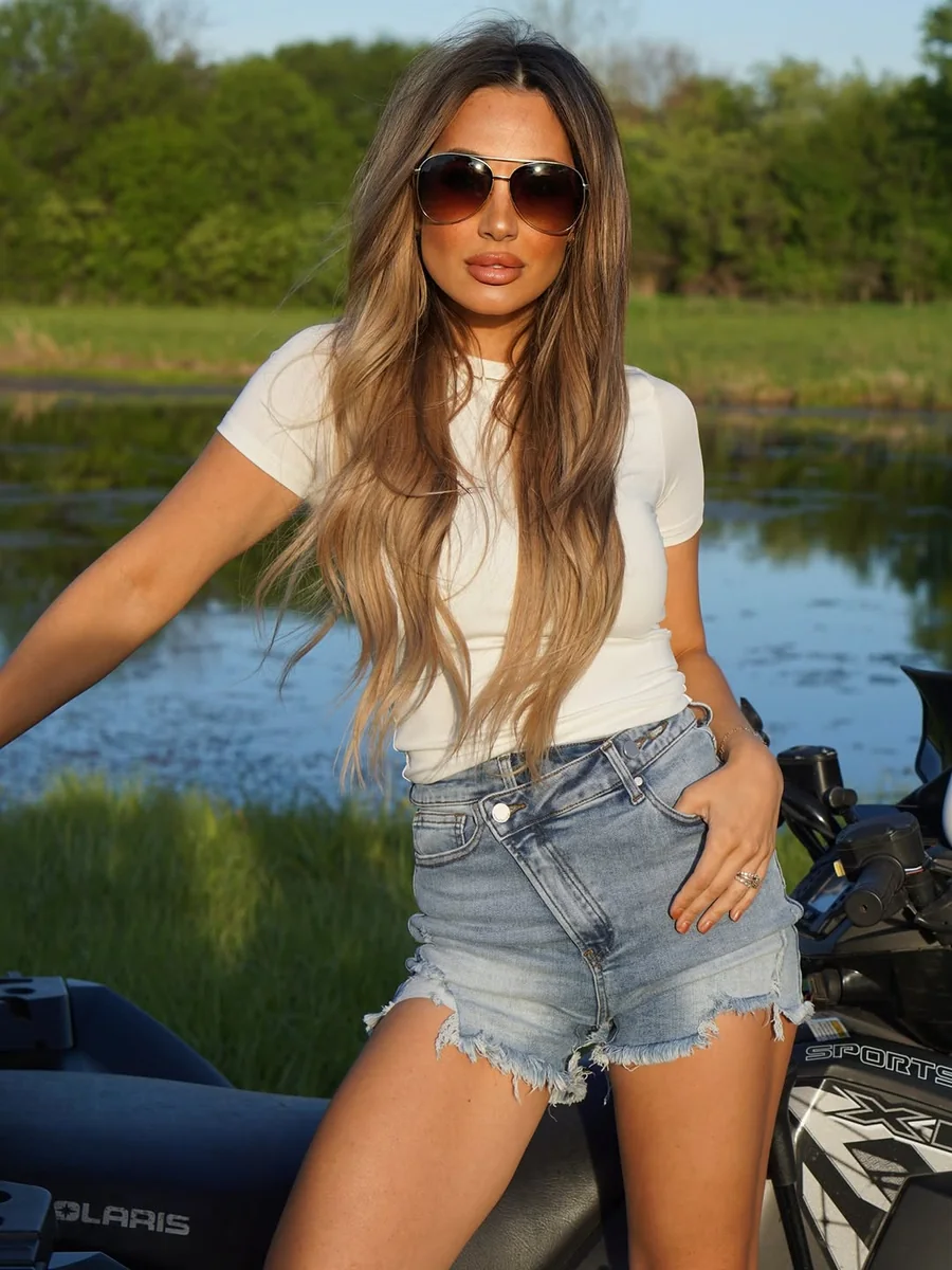 The Fitted Tee and Cutoff Shorts on a petite woman
