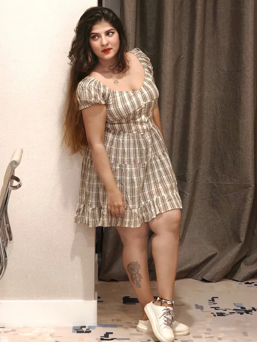 Plaid Minis With Puff Sleeves on a petite woman