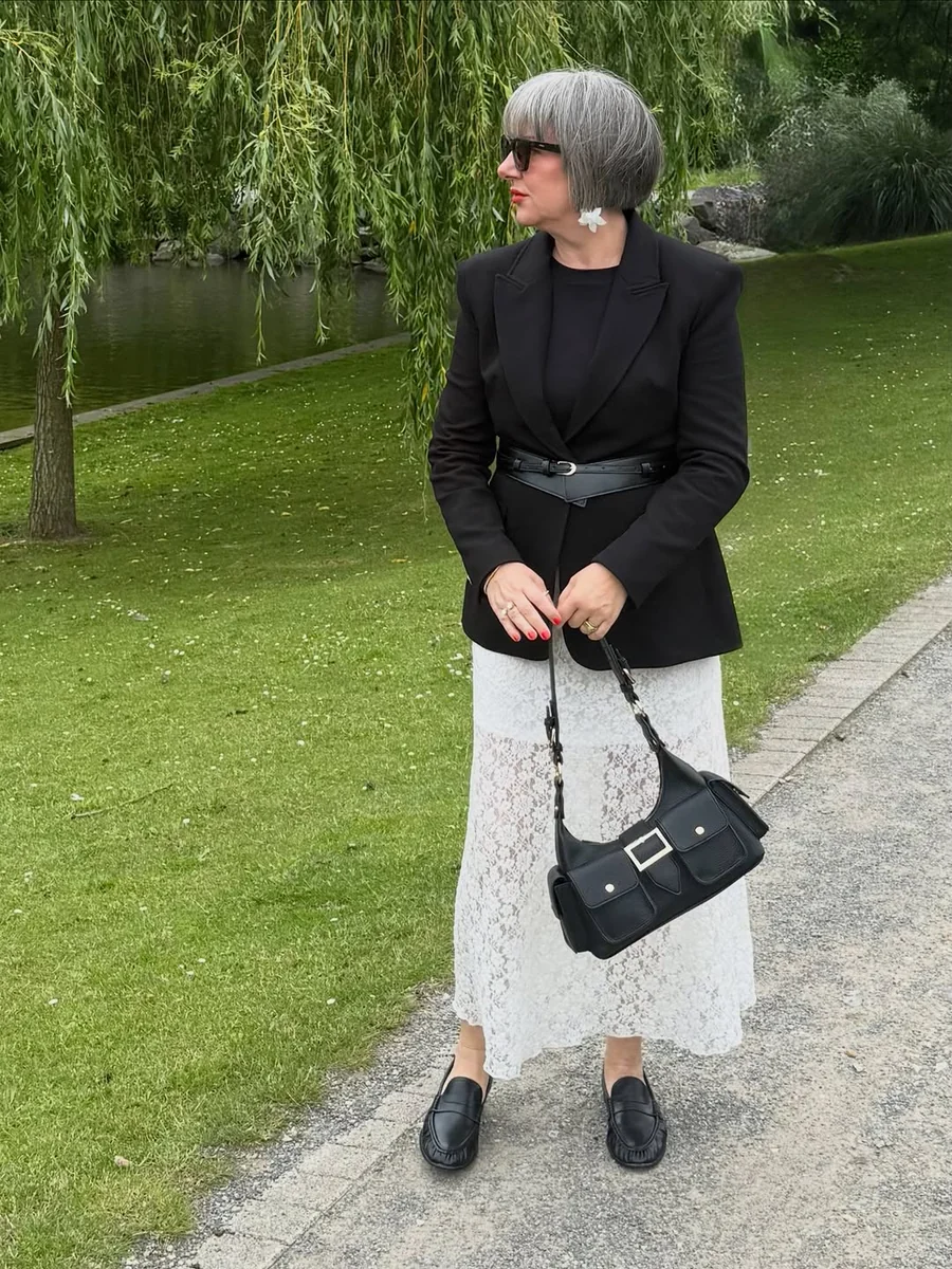 A Belted Black Blazer Over White Lace, a Petite Fashion Over 50 Power Pair on a petite woman