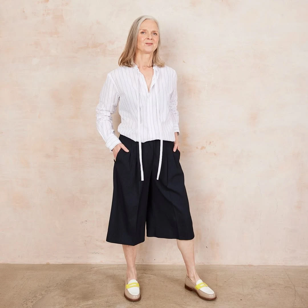The White Shirt, Black Shorts City Formula on a petite woman
