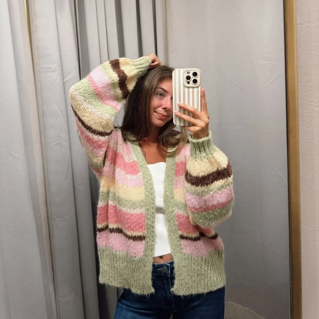 The Chunky Pastel Cardigan on a petite woman
