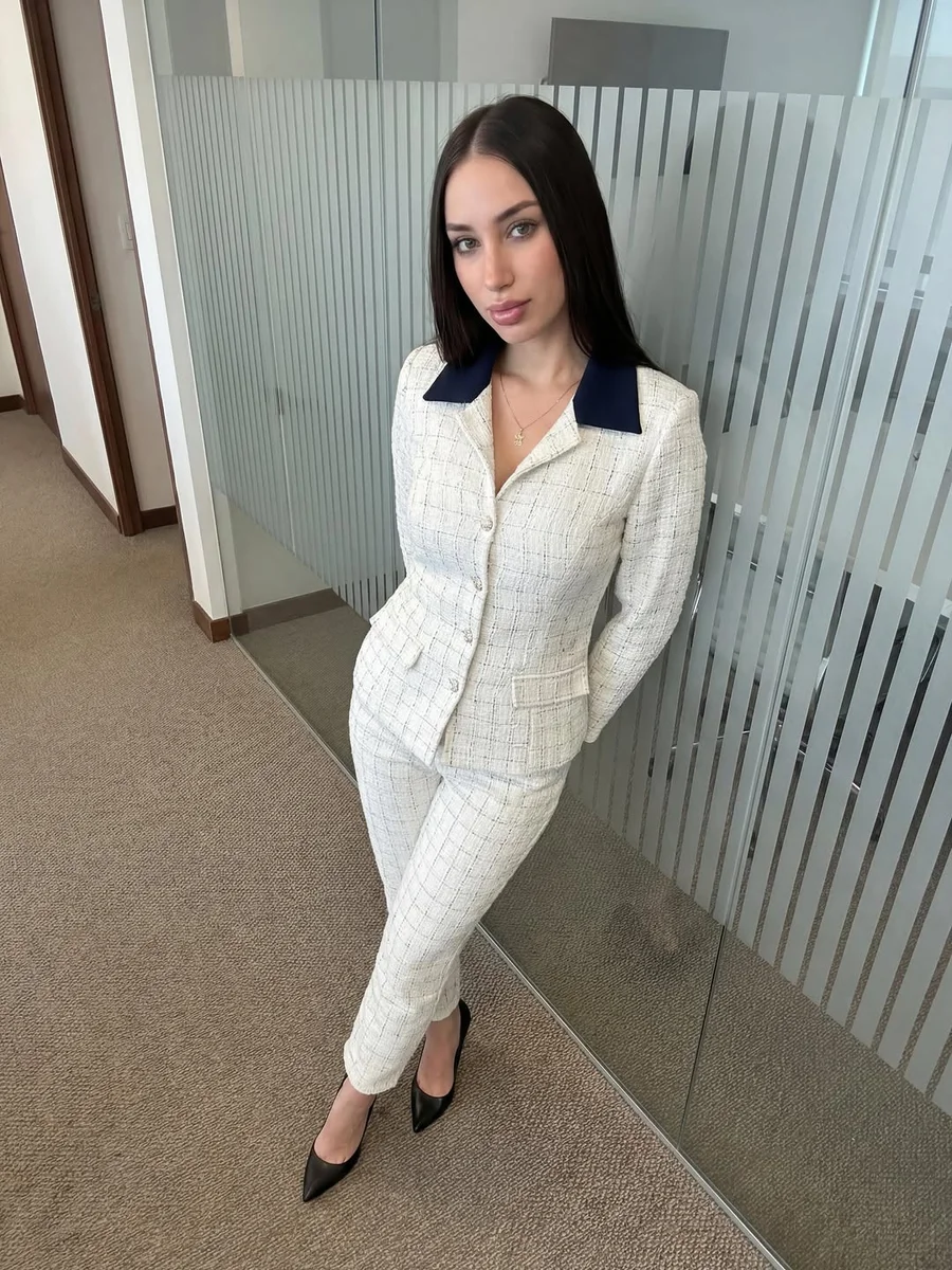 A White Tweed Blazer With a Contrast Collar on a petite woman