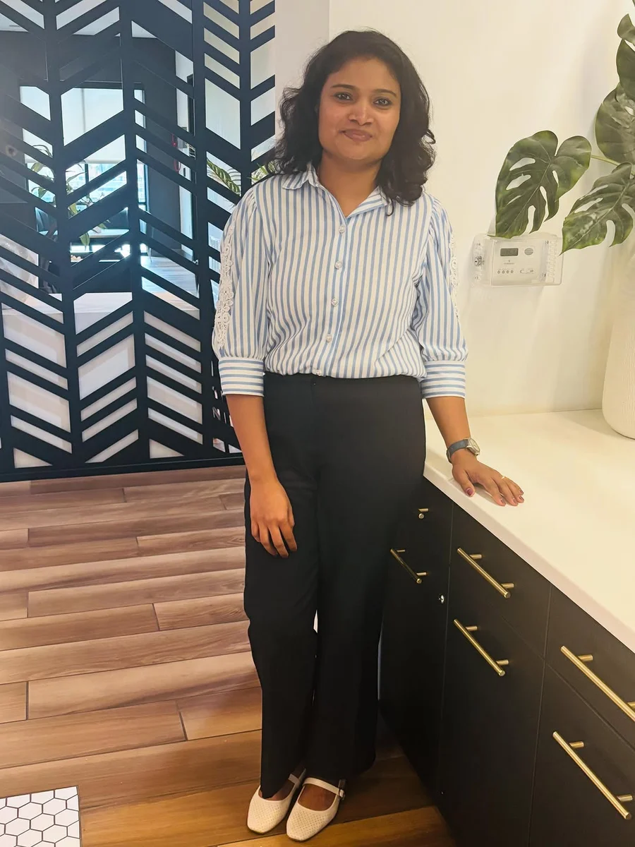 Striped Button Shirt and Black Wide-Leg Trousers on a petite woman