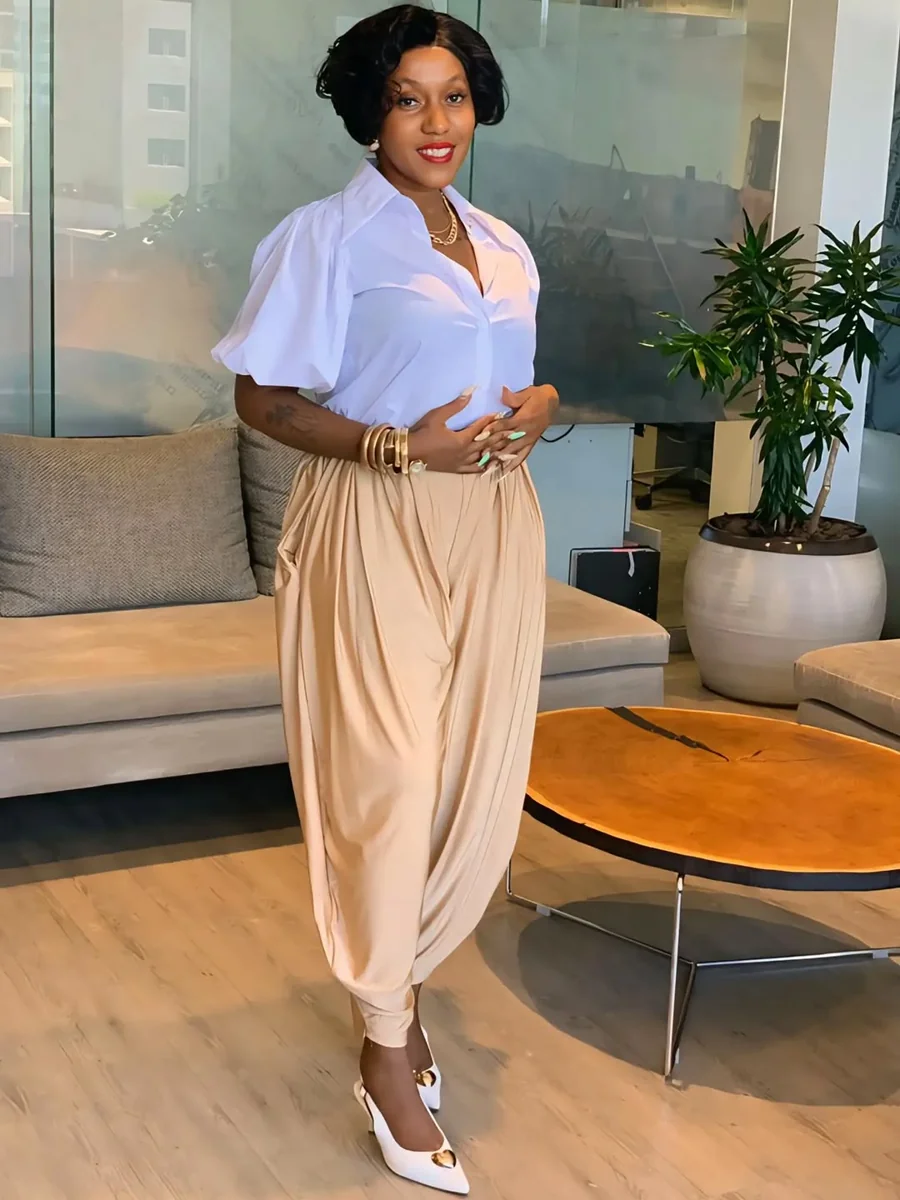 The White Blouse and Champagne Draped Trousers on a petite woman