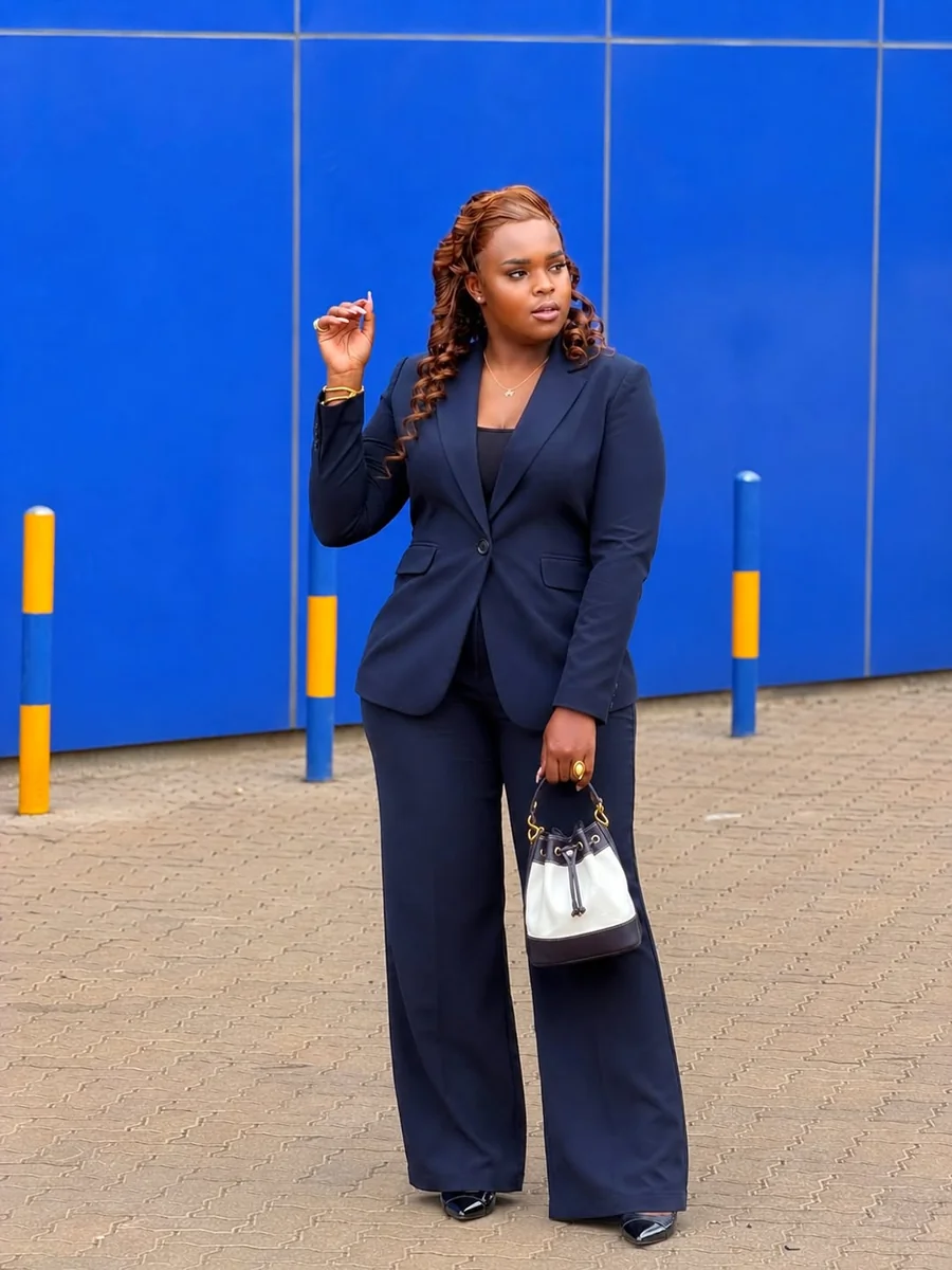 Navy Pantsuit With a Contrasting Bag on a petite woman