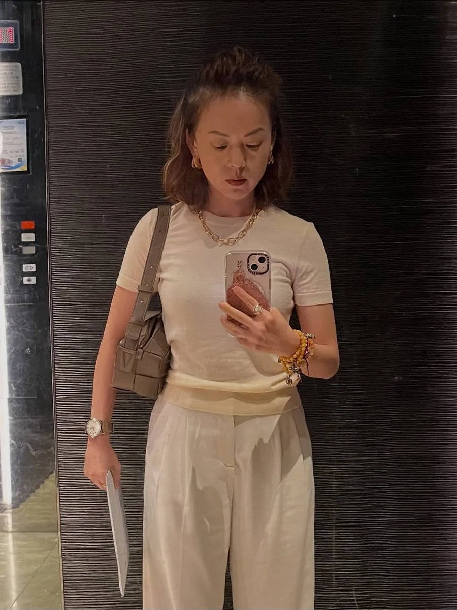 All-Cream Knit With Wide-Leg Trousers on a petite woman