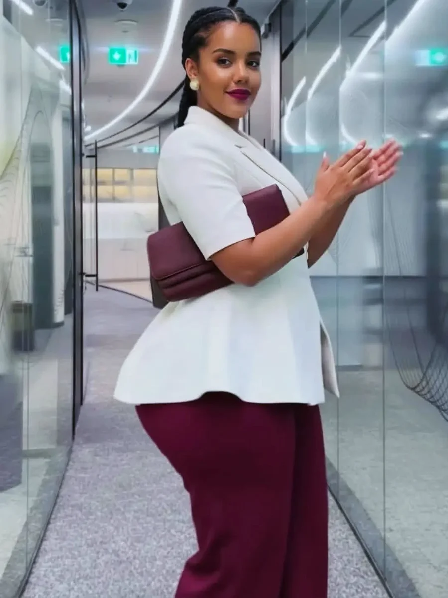 White Peplum Blazer With Maroon Trousers on a petite woman