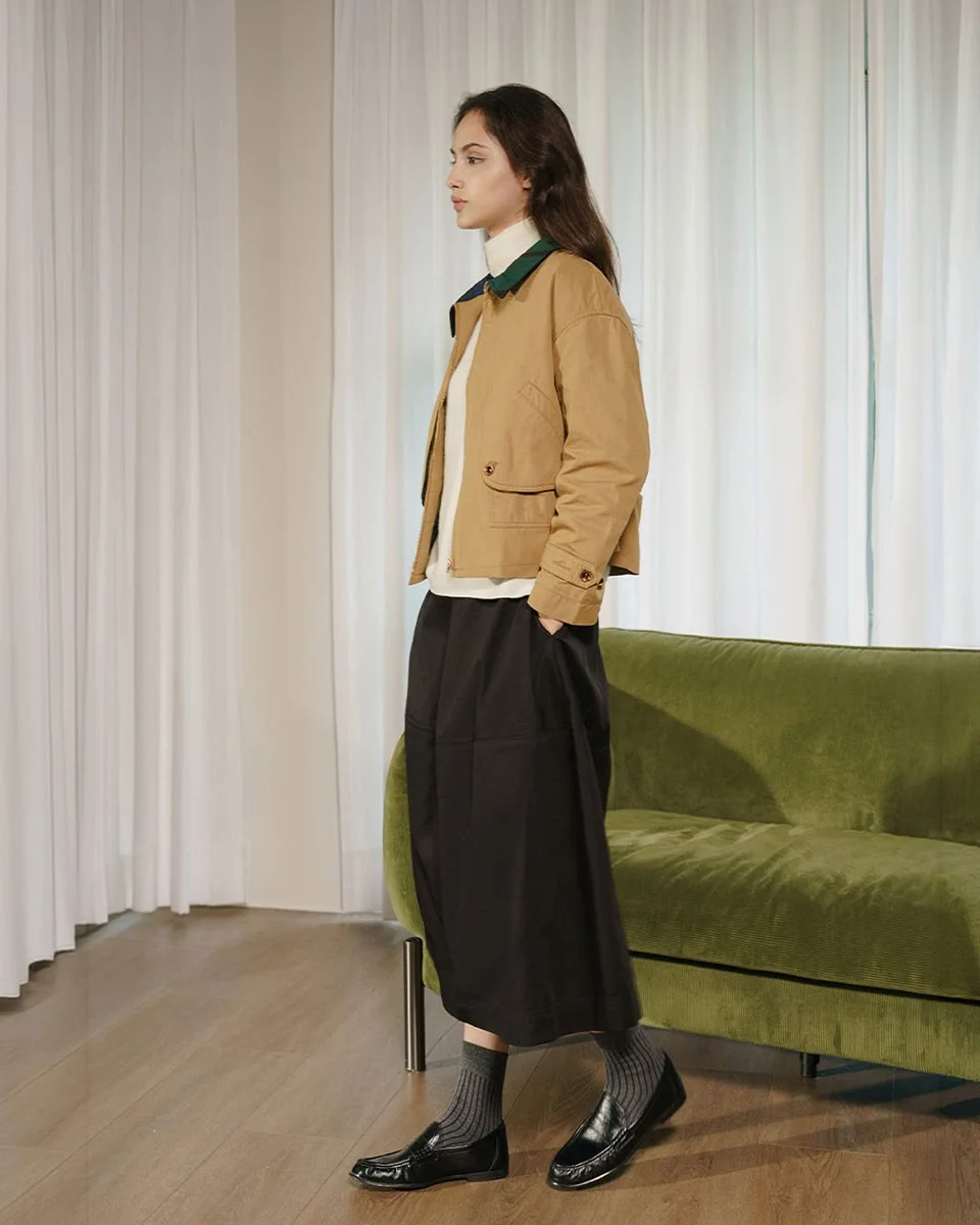 Chore Jacket, Turtleneck, and a Culotte Skirt on a petite woman