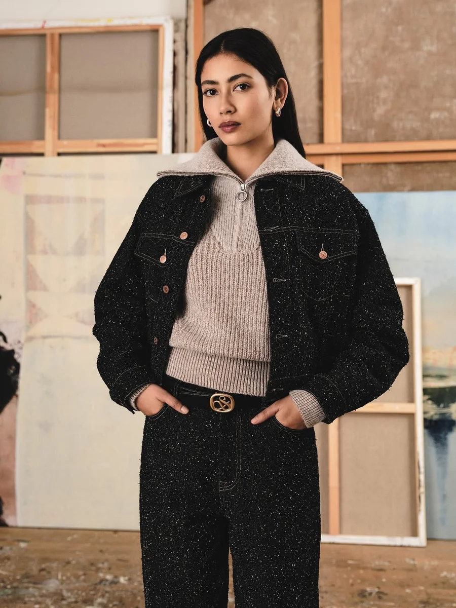 Black Tweed Trucker Jacket With an Oatmeal Half-Zip on a petite woman