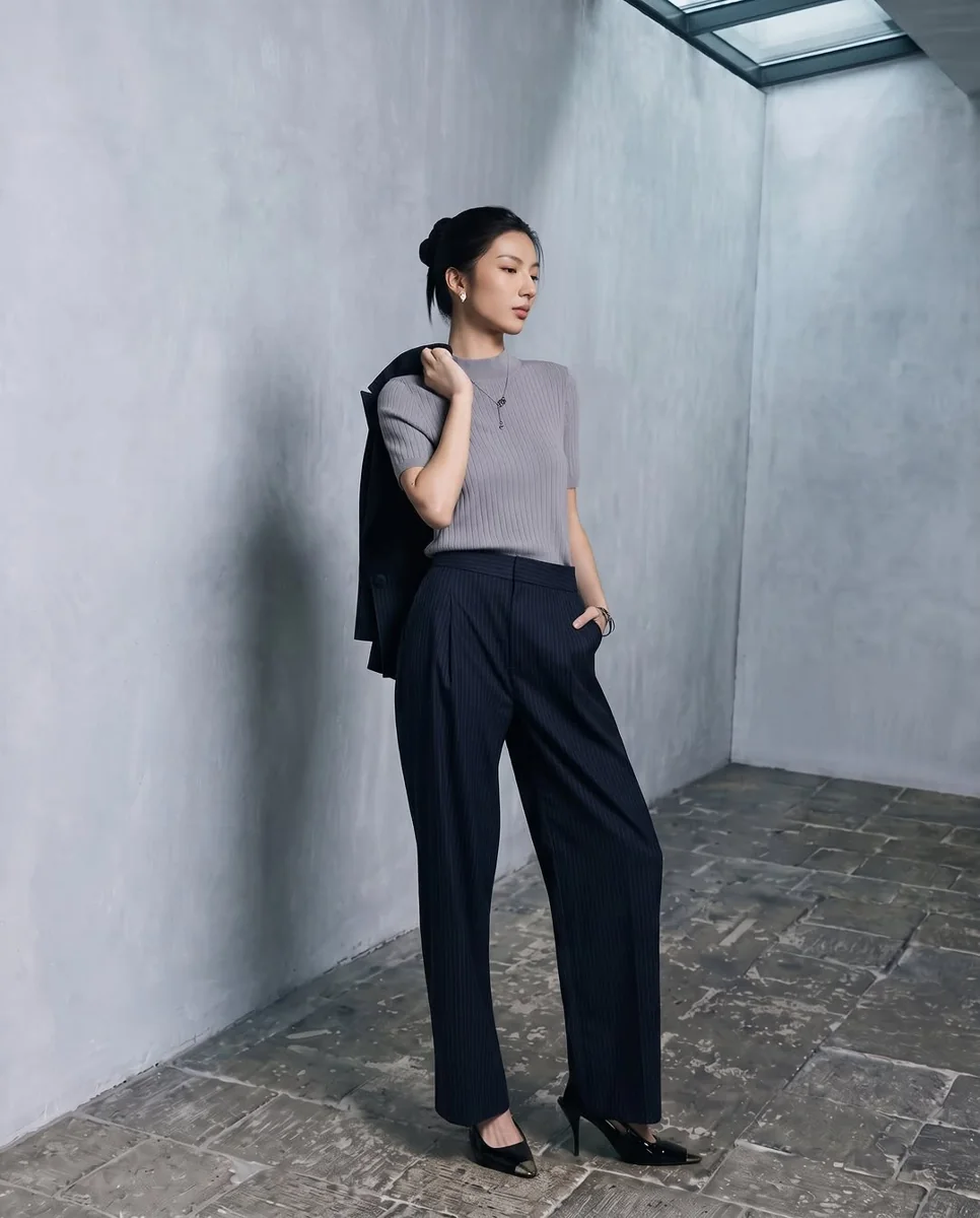 Pinstripe Wide-Leg Trousers With a Draped Blazer on a petite woman