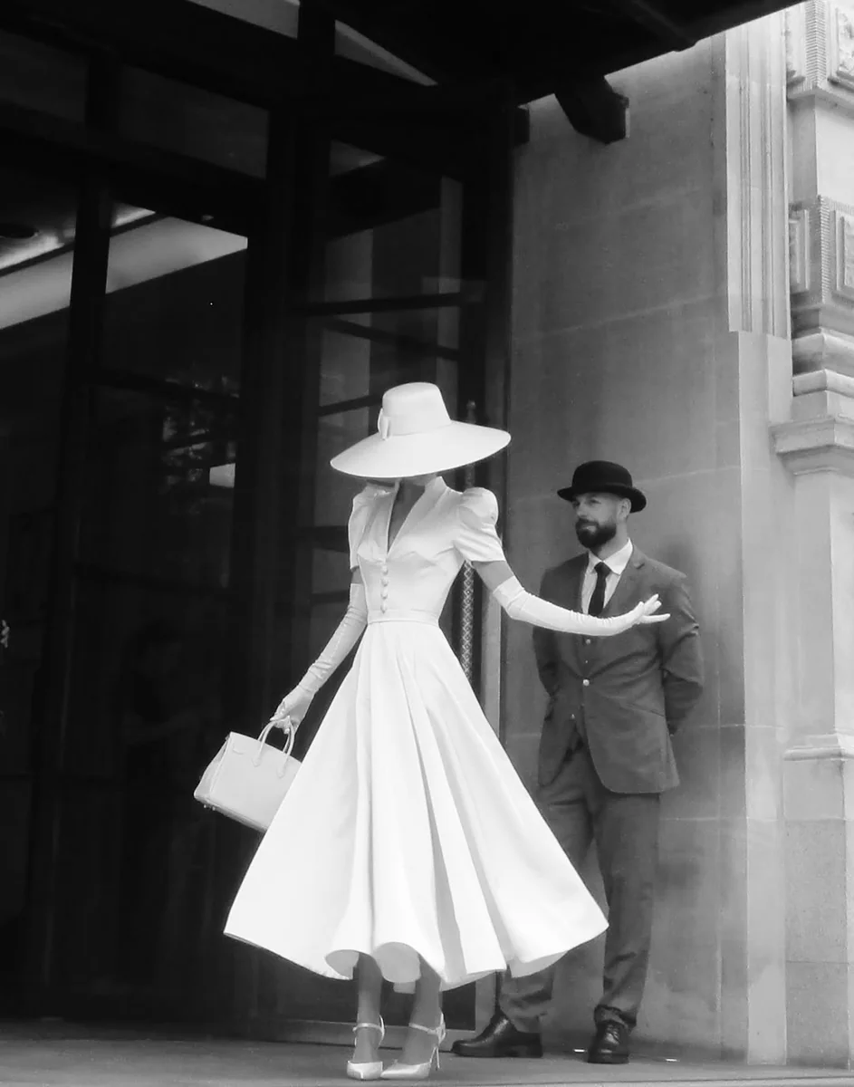 A Vintage White Fit-and-Flare, Among the Best Dresses for Petite Women Who Love Retro Glamour on a petite woman