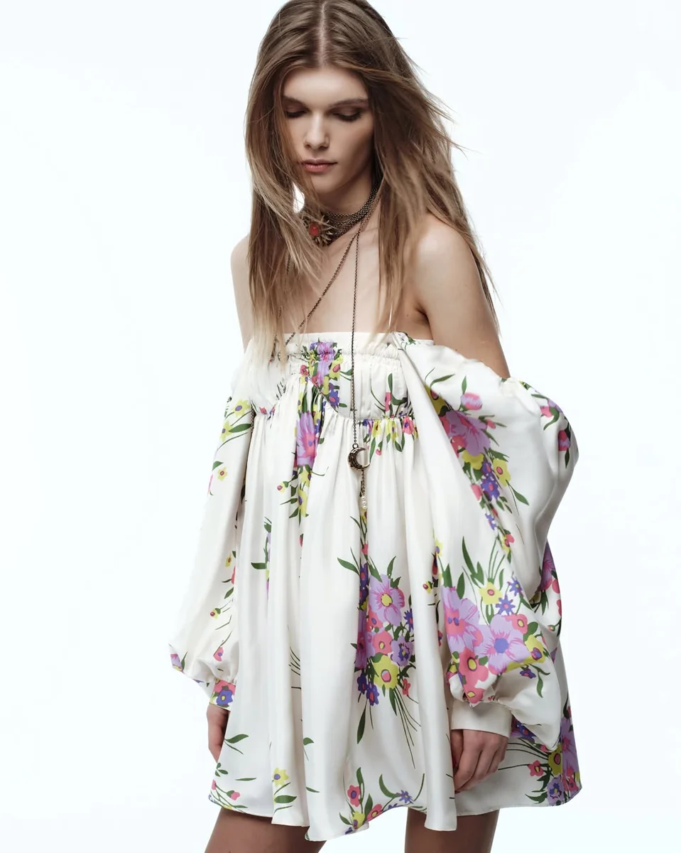 Off-Shoulder Ruffle Sleeves That Keep the Hem High on a petite woman