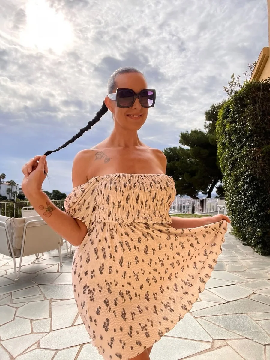 The Smocked Off-Shoulder Mini for Resort Days on a petite woman