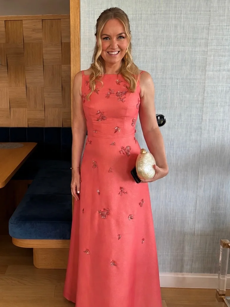 Petite Wedding Guest Dresses Go Black Tie in Coral on a petite woman