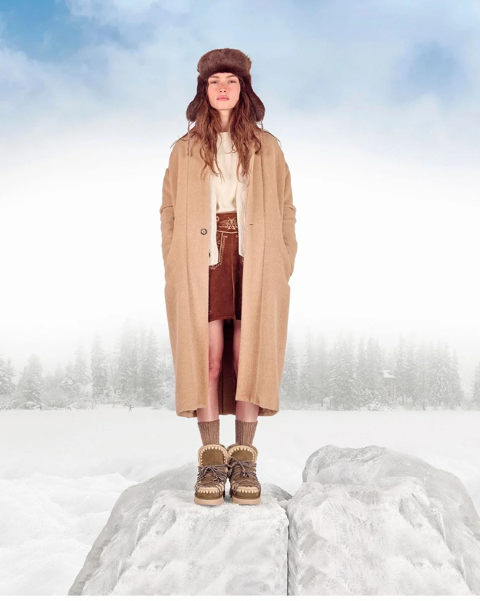 Camel, Cocoa, and a Trapper Hat on a petite woman