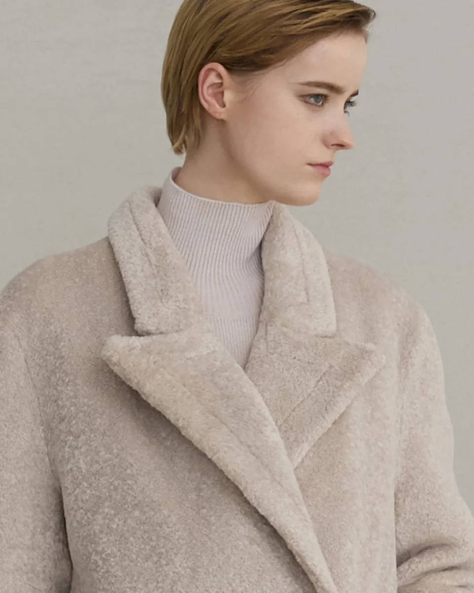 The Cream Teddy Coat That Softens a Winter Look on a petite woman