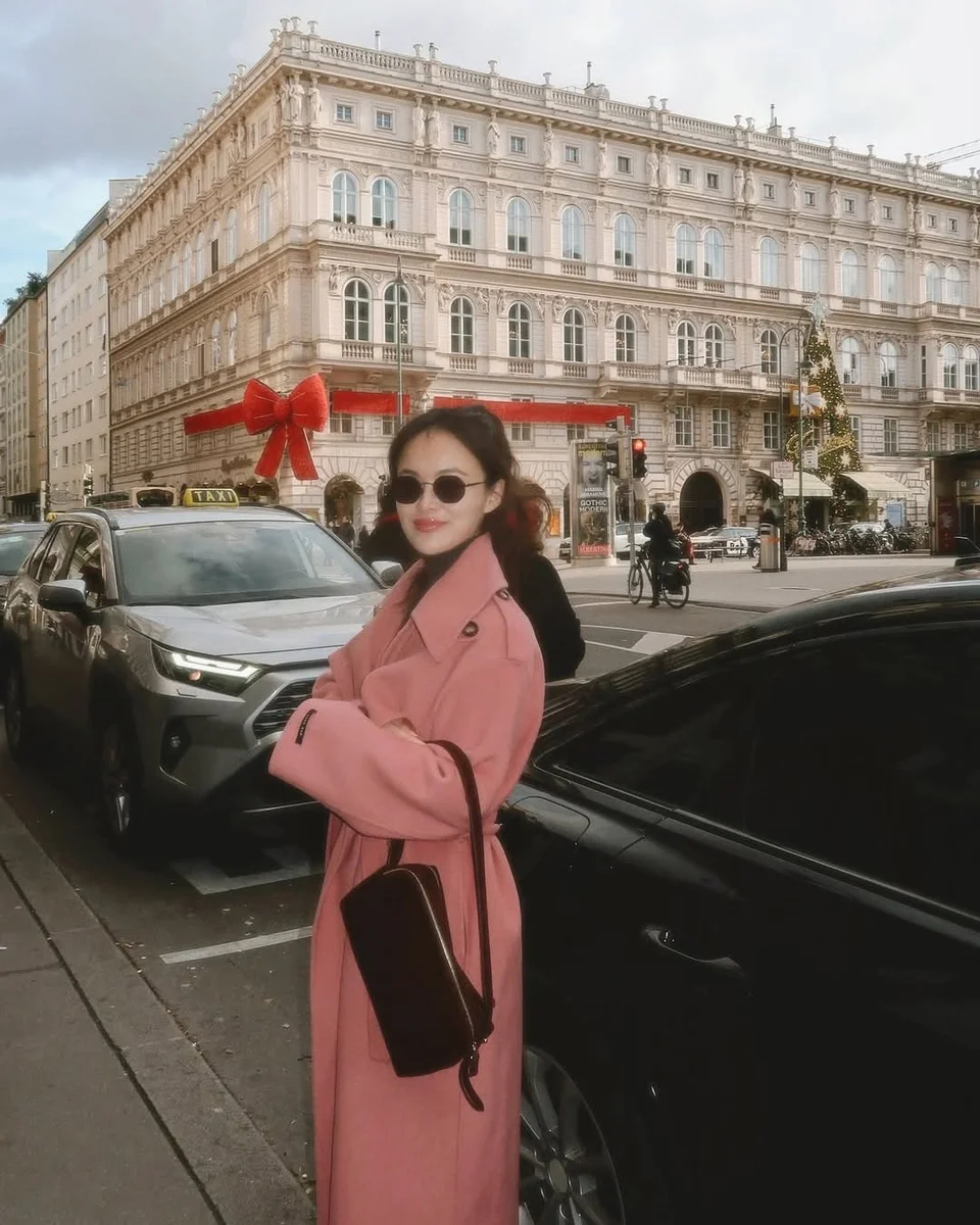 A Coral Coat That Brightens Gray Winter Days on a petite woman