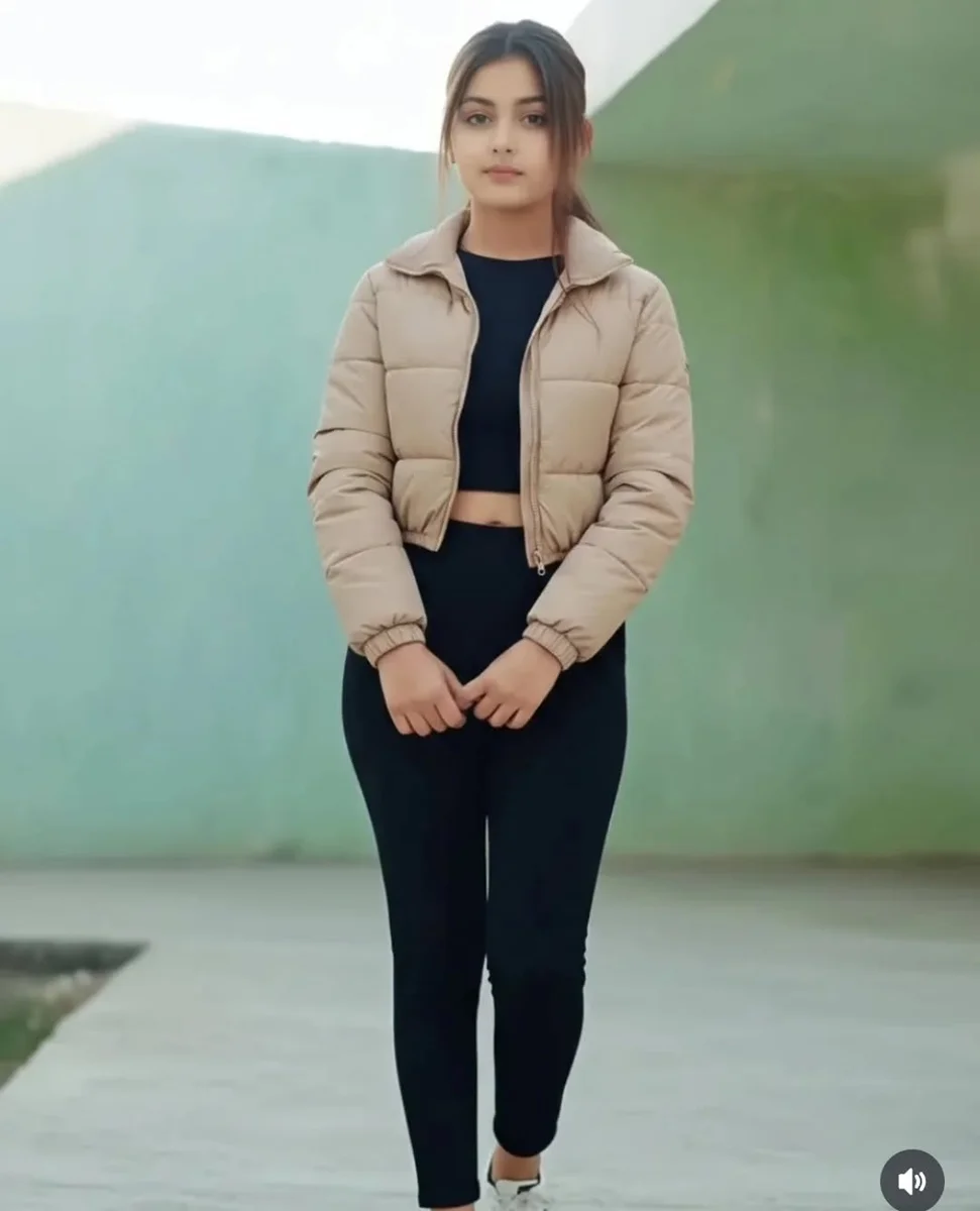 The Cropped Puffer Jacket Petite Frames Were Made For on a petite woman