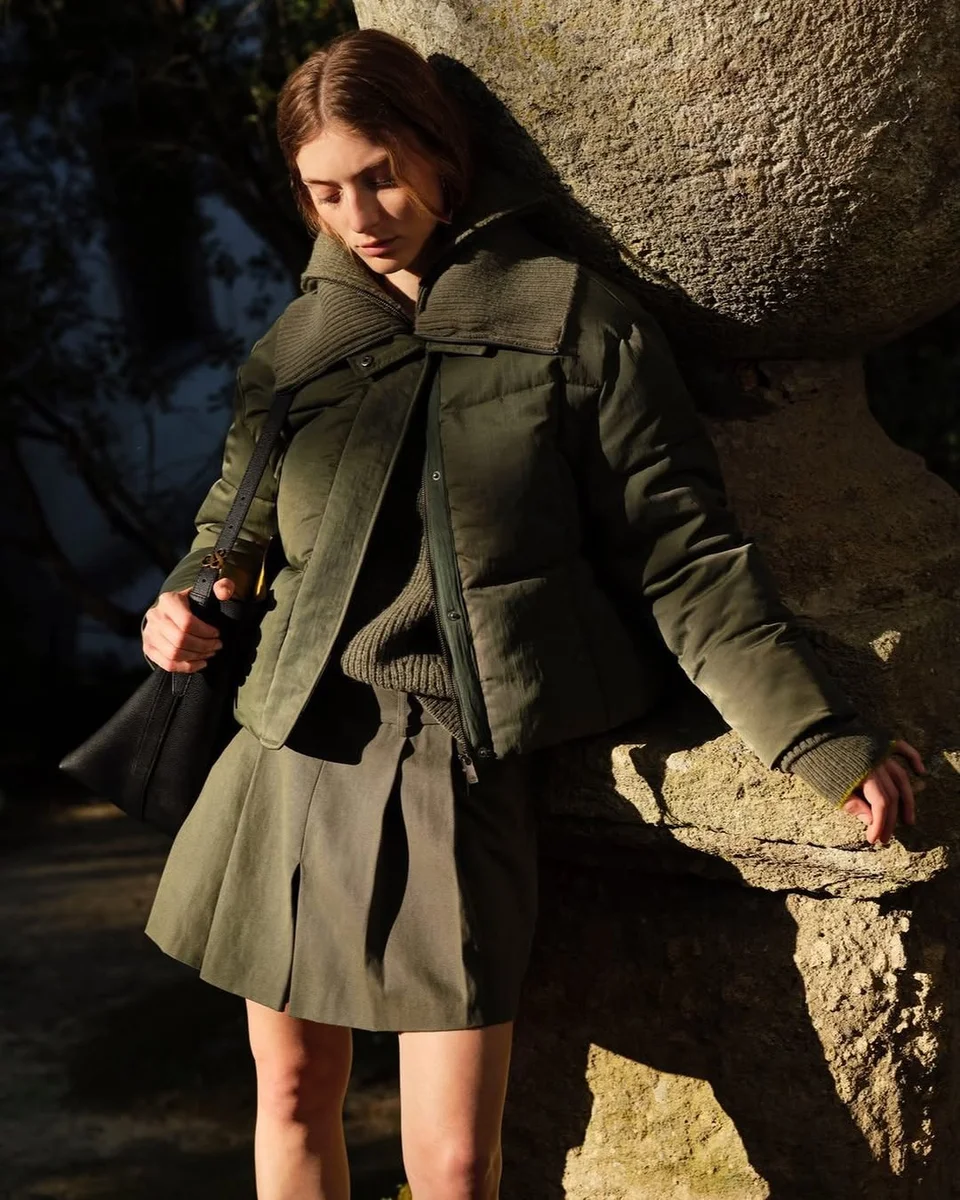 An Olive Puffer With a Pleated Skirt, for Mild Days on a petite woman
