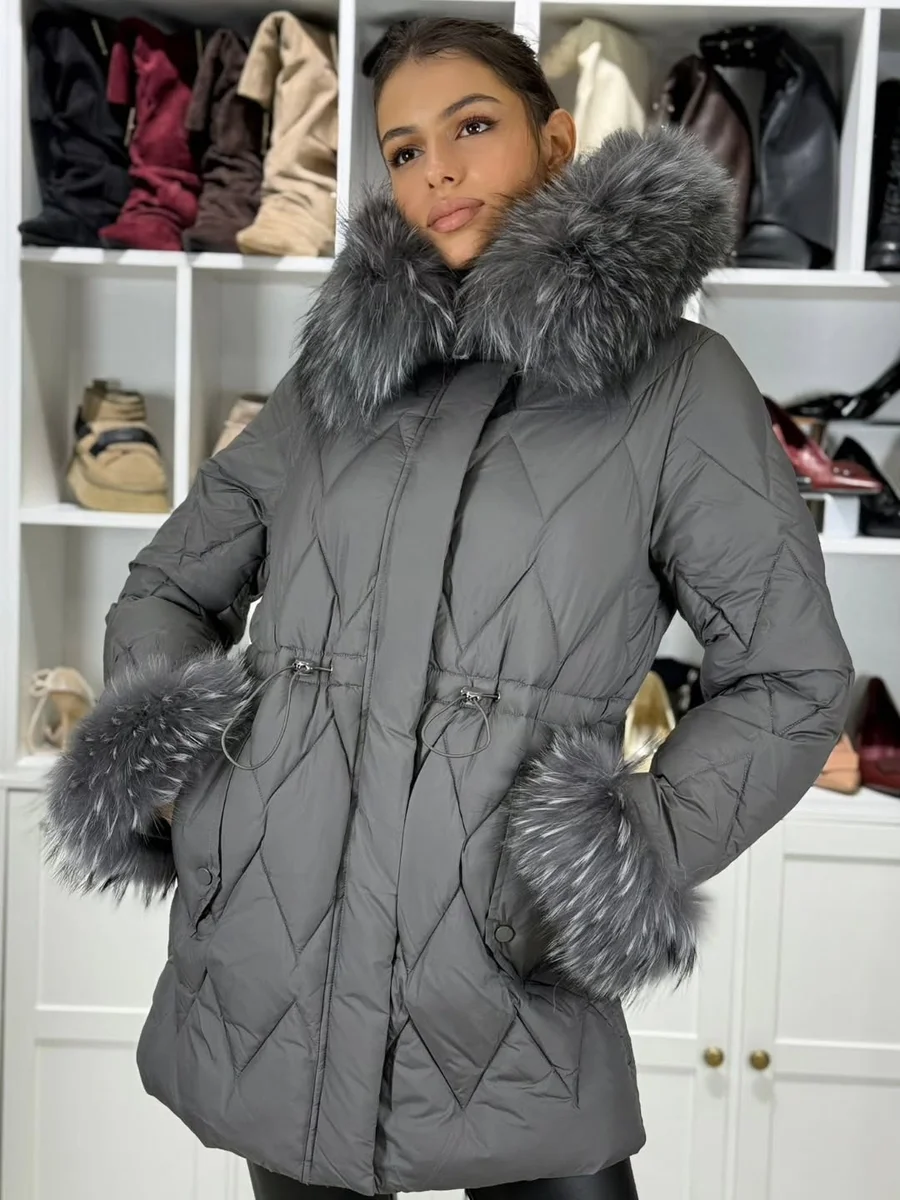 Gray Diamond Quilt With Fur Trim on a petite woman