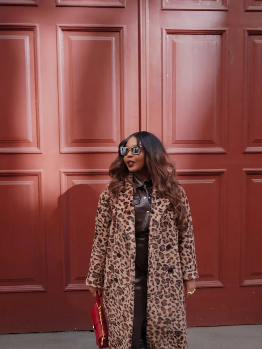 Leopard Coat, Leather, and a Red Bag by a Red Door on a petite woman