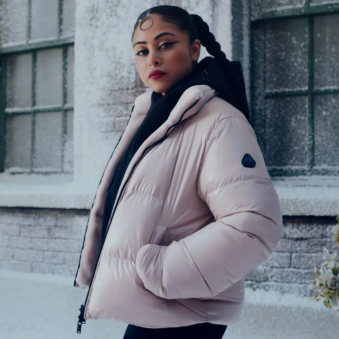 The Blush Puffer for Snowy Days on a petite woman