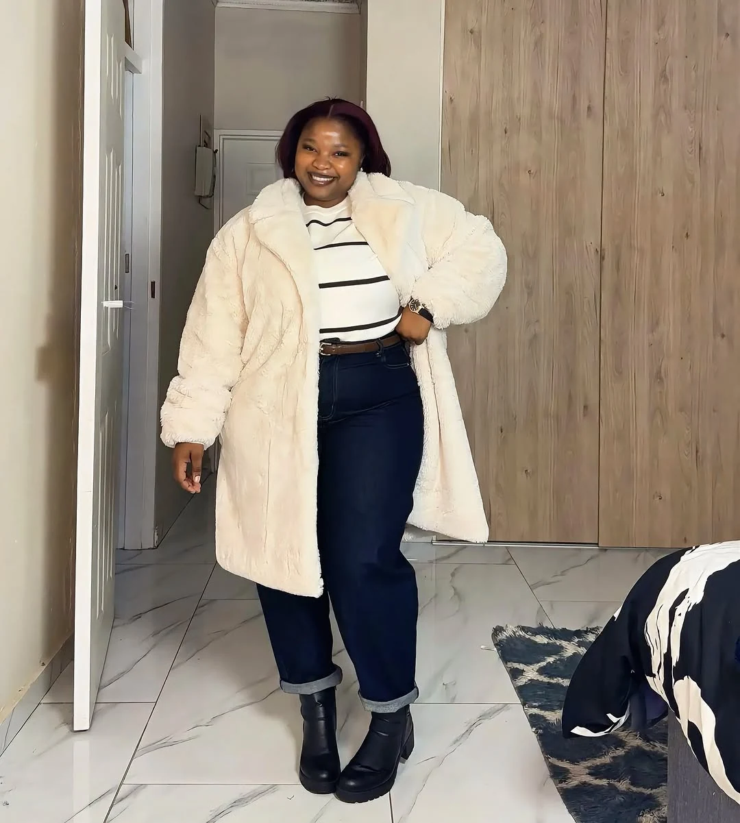 The Plush Faux-Fur Statement Coat on a petite woman