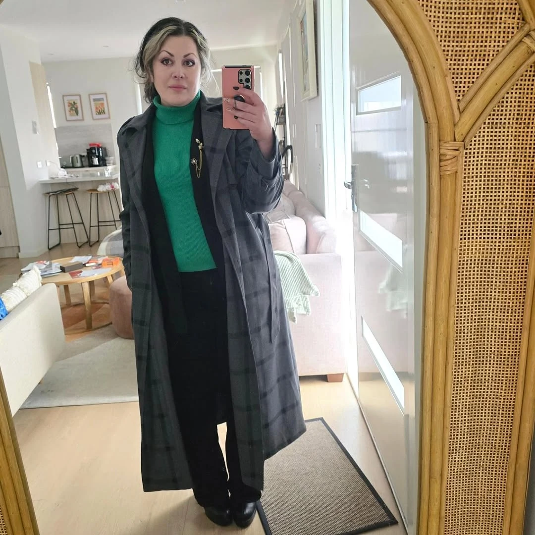 The Bright Turtleneck Under a Long Coat on a petite woman
