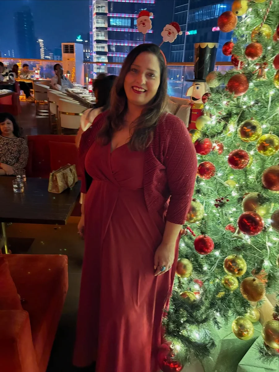 A Burgundy Wrap Maxi With a Cozy Layer on a petite woman