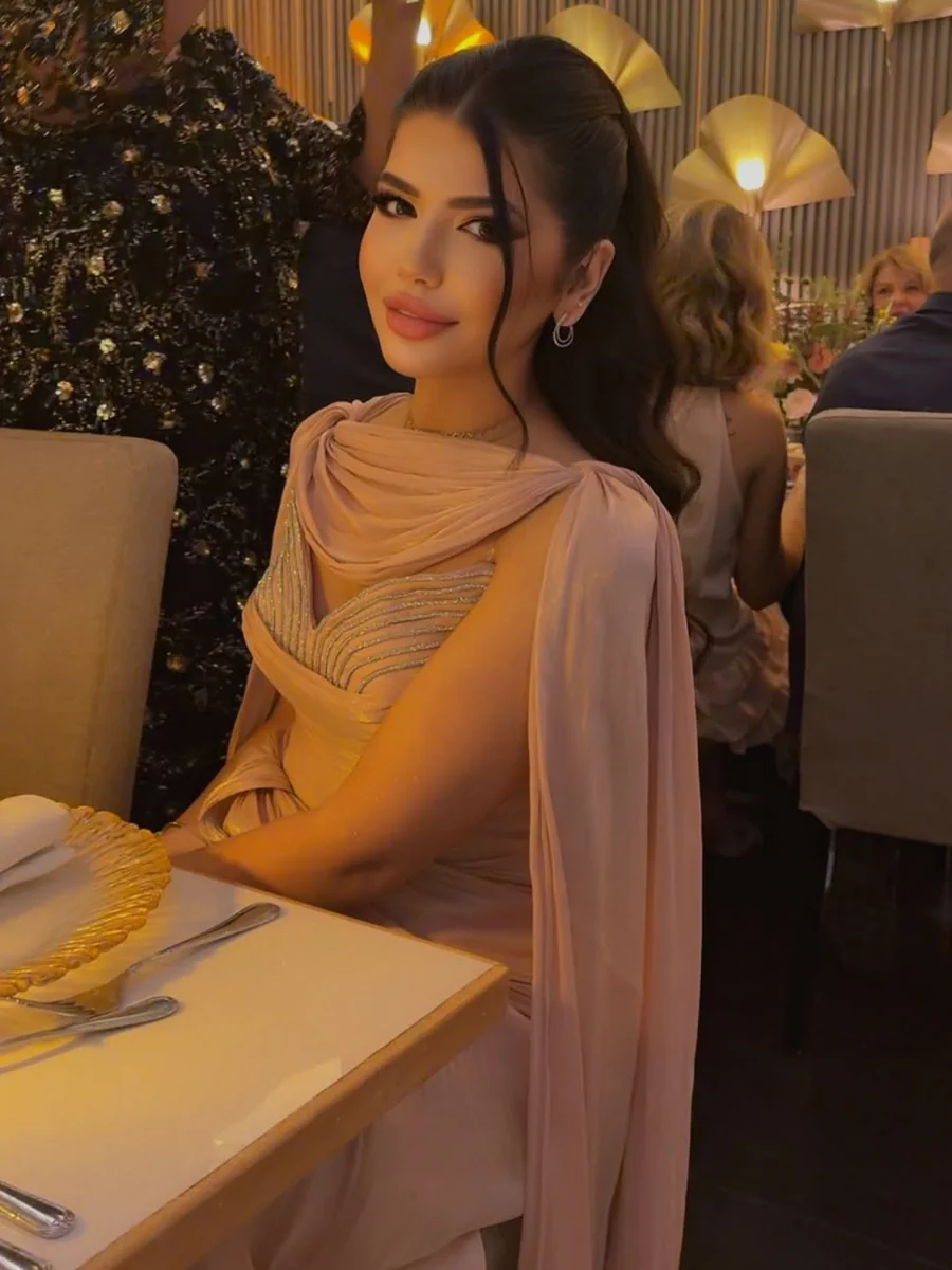 A Blush Draped Dress That Glows in Candlelight on a petite woman