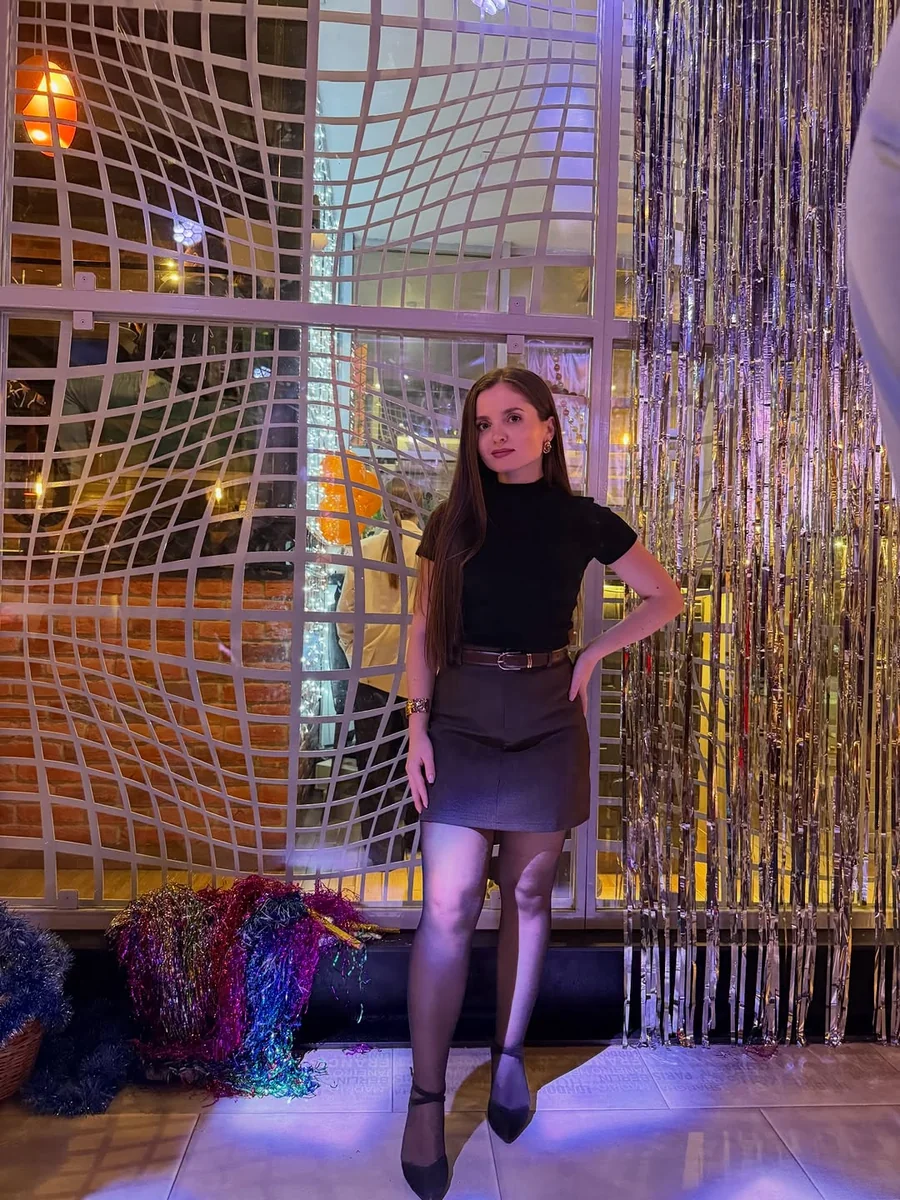 A Turtleneck Makes Sequins Office-Safe on a petite woman