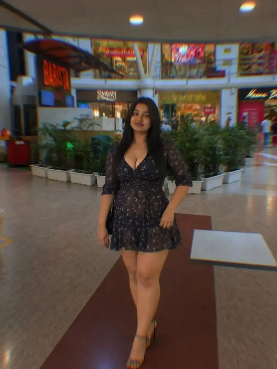 The Little Black Dress, But Make It a Print on a petite woman