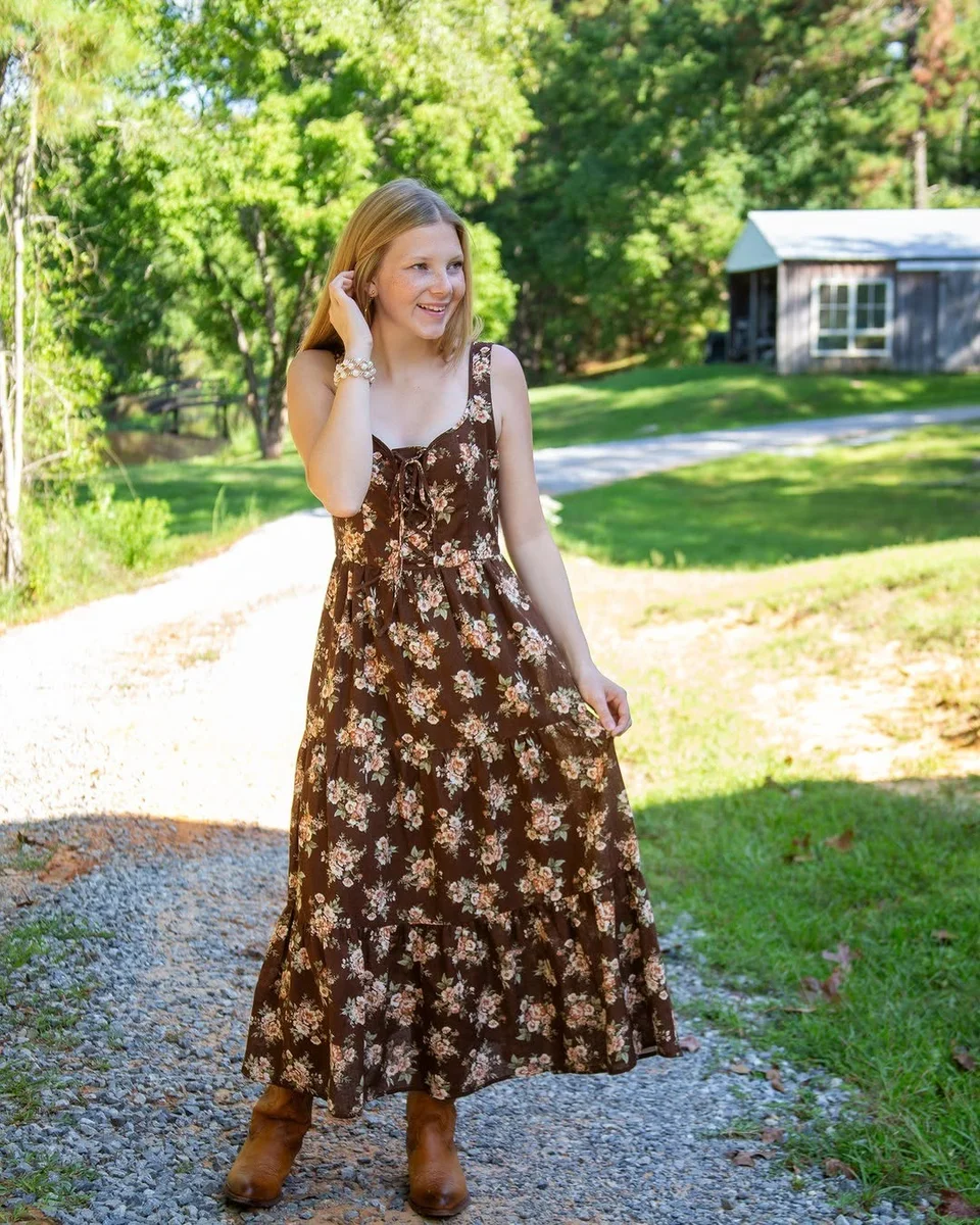 The Brown Floral Maxi, Boots Included on a petite woman