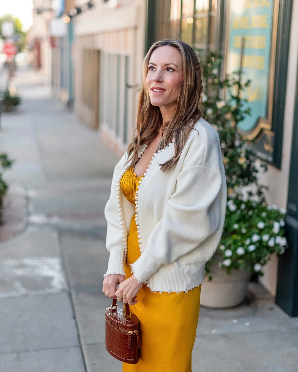 Mustard Midi, White Cardigan on a petite woman