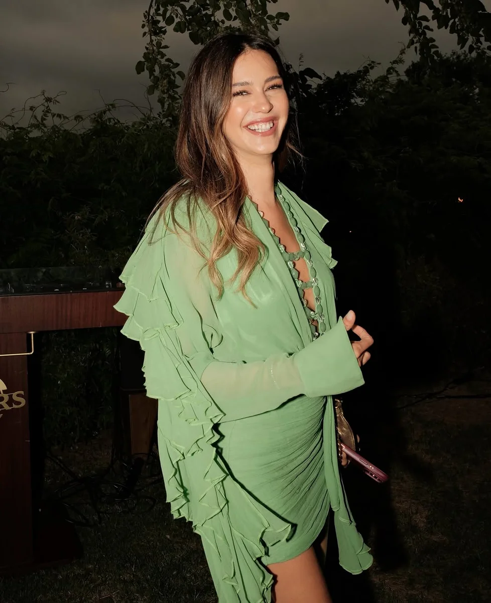 A Green Ruffle Mini That Loves the Camera on a petite woman
