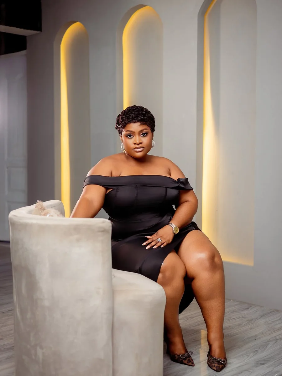 Off-Shoulder Black Midi, Seated in Confidence on a petite woman