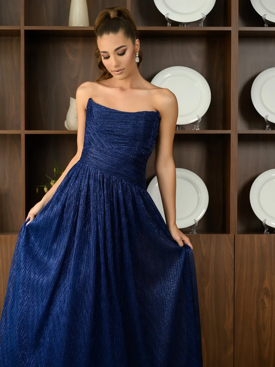 Navy Strapless Ball Gown on a petite woman