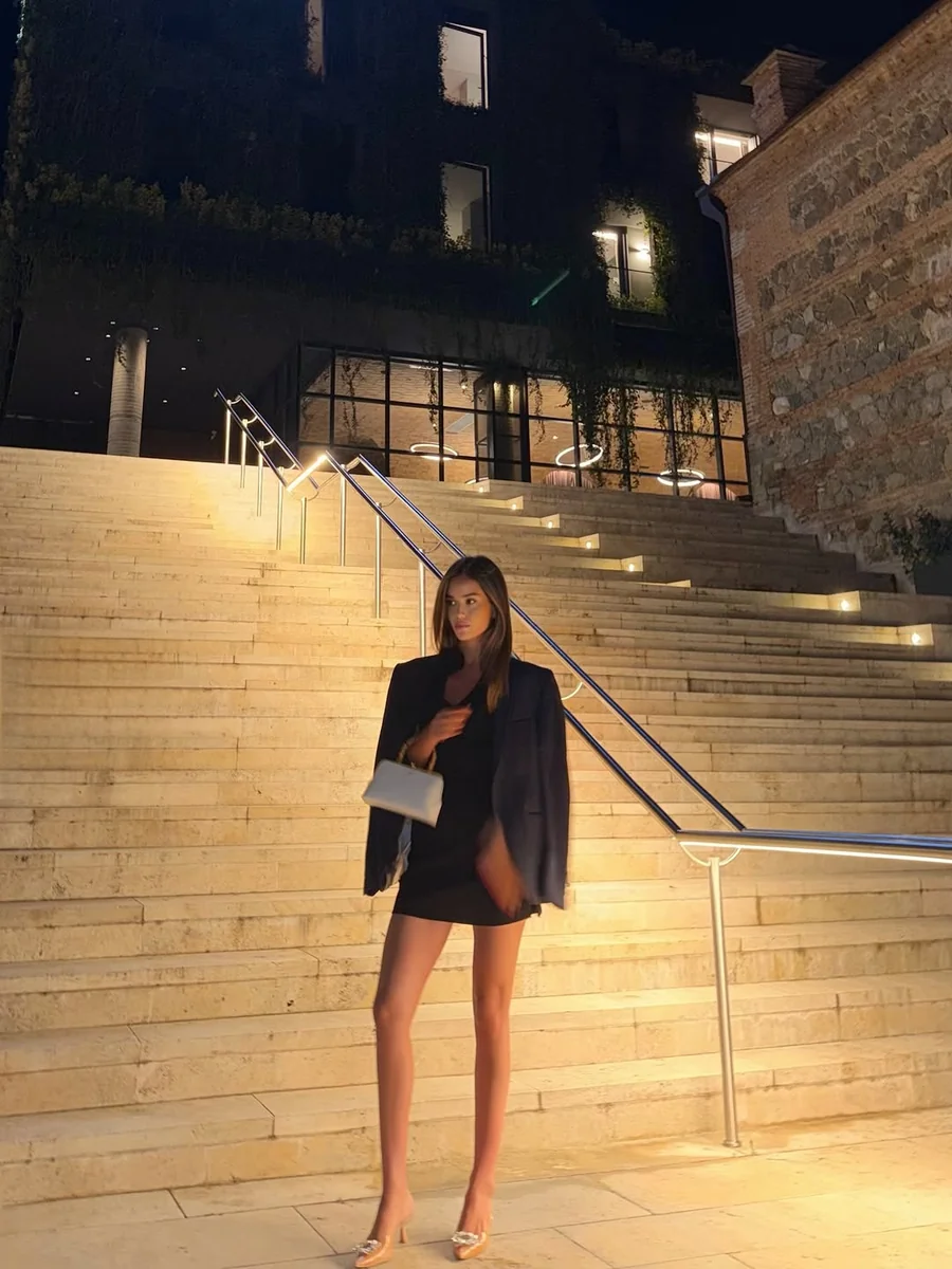 A Blazer Over a Mini, on the Stairs on a petite woman